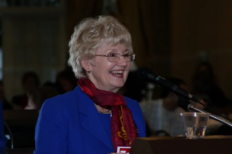 Faith Loudon speaking at a podium